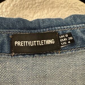 Denim button down shirt. Size 4 but fits oversized. Great quality- barely worn